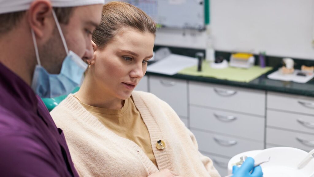 Patient discussing symptoms and treatment options with a dentist