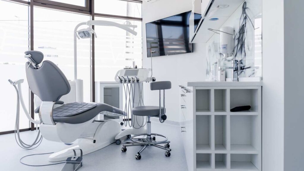 Modern dental clinic treatment room with chair and equipment, representing top cosmetic dentistry clinics in Russia.