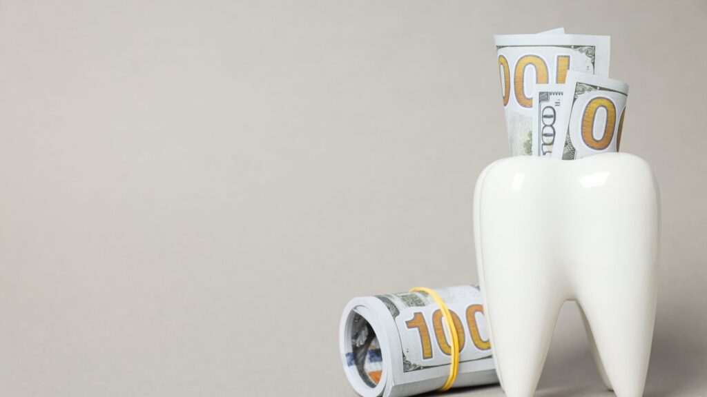 Tooth and money image for Hollywood Smile cost in Saudi Arabia (2026), including veneers, bonding, and whitening price differences.